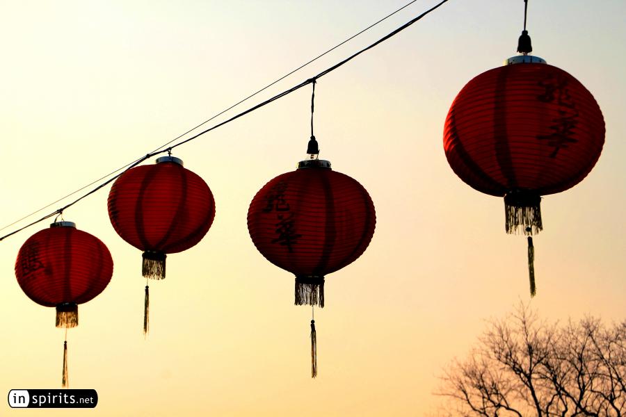 Chinese lanterns glow in the winter sunset