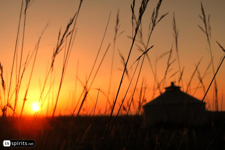 The sun is rising over the Mongolian grassland