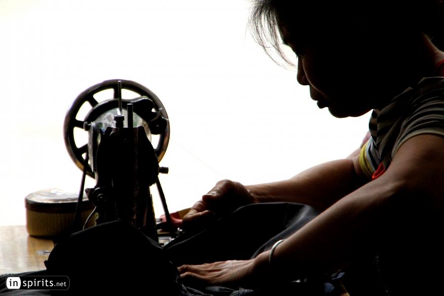 Chinese Woman on a Sewing Machine in Guangxi