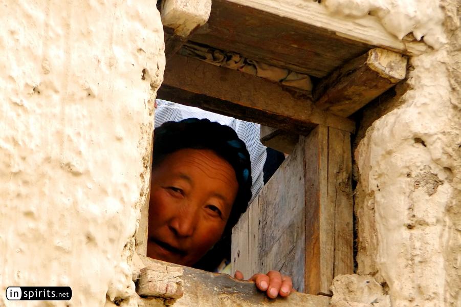 Tibetan woman in Gyantse appears in the window