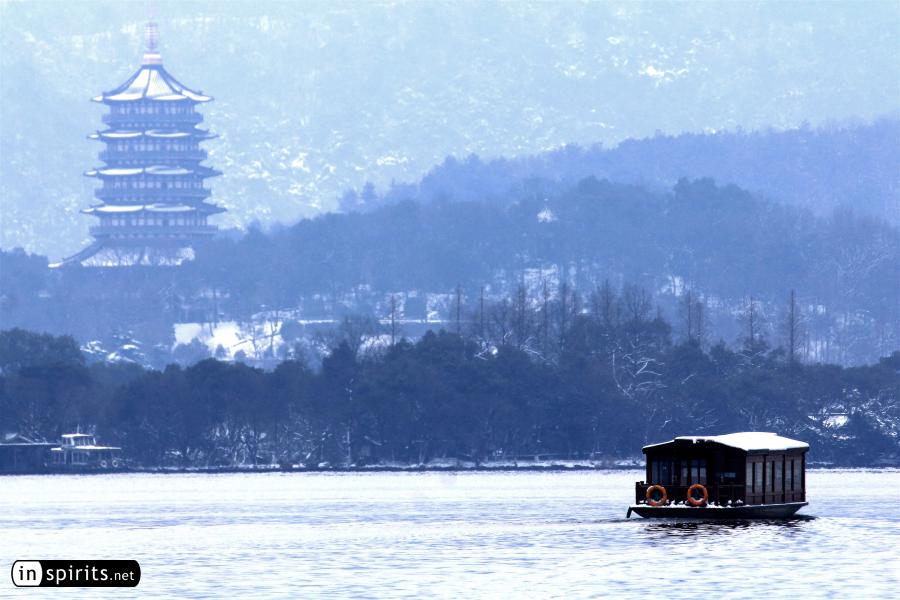 Chinese Boat on icy West Lake in Winter