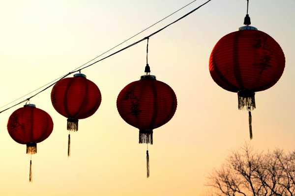 Chinese lanterns glow in the winter sunset