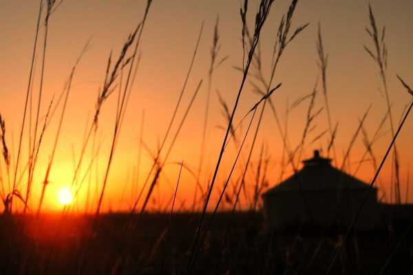 The sun is rising over the Mongolian grassland