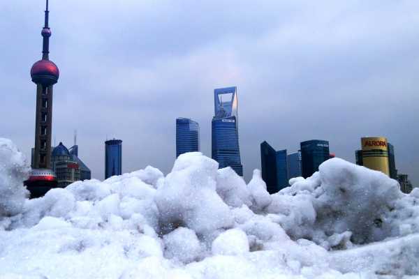 Shanghai's skyscrapers clad in snow