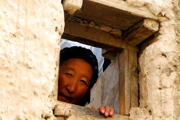 Tibetan woman in Gyantse appears in the window